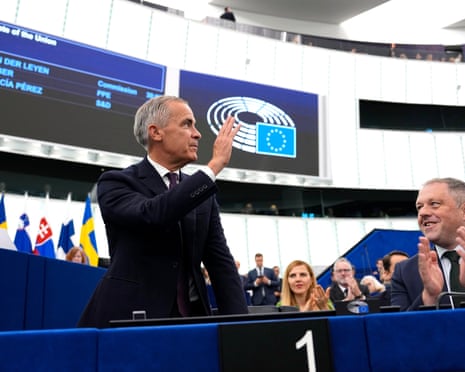 Canadian prime minister Mark Carney waves as he is applauded as he arrives at the European Parliament in Strasbourg, France.