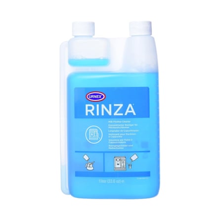 A 1.1 litre bottle of Urnex Rinza milk system cleaner. The liquid is bright blur through the opaque plastic bottle.