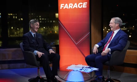 Nigel Farage on his show talking to Jacob Rees-Mogg in the studio at GB News, with Farage in large font in the background