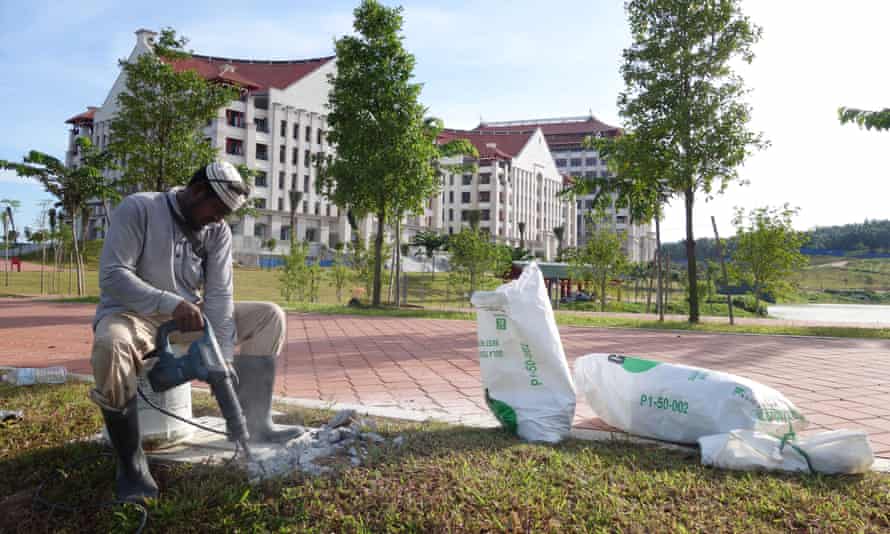 A labourer works on completing the campus.
