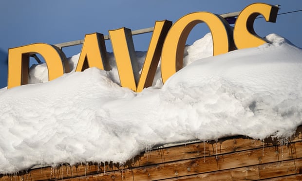Letters covered in snow reading Davos are pictured on the rooftop of a hotel, near the Congress Centre in Davos, eastern Switzerland