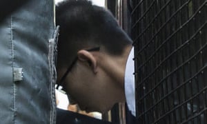 Joshua Wong leaves a prison van after arriving at the court of final appeal for his bail application.