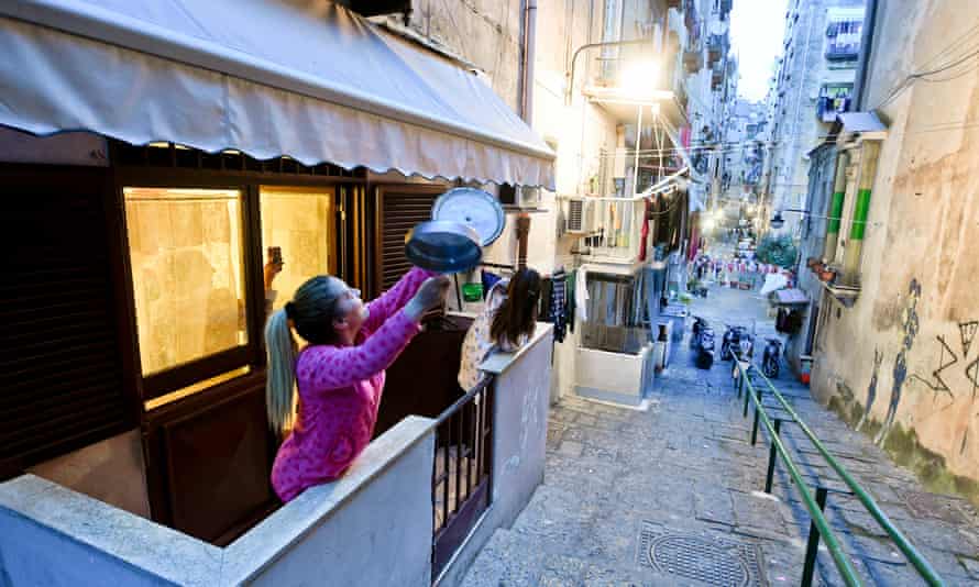 Residents of Quartieri Spagnoli, Naples, sing together from their balconies during lockdown in March 2020.