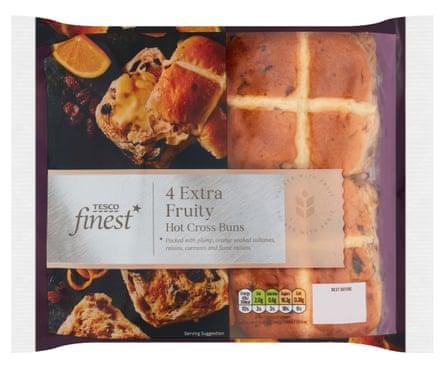 Four Tesco Finest Extra Fruity Hot Cross Buns in a packet