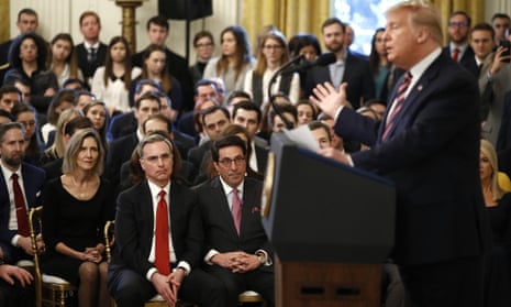Pat Cipollone, bottom left in the red tie, sits with Jay Sekulow, Donald Trump's personal lawyer, in the East Room of the White House in Februray 2020.