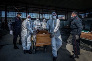 Military and medical personnel and police transport coffins in Ponte San Pietro.