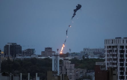 A drone explodes and falls to the earth in Kyiv on Thursday.