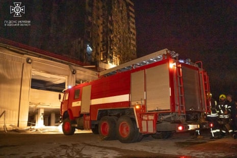 Firefighters on the scene of an attack on Odesa.