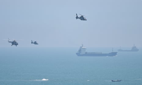 Chinese military helicopters fly past Pingtan island, one of the mainland’s closest points to Taiwan, ahead of military drills sparked by Nancy Pelosi’s visit.