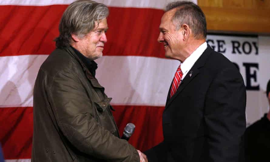 Bannon shakes hands with Roy Moore. The latter’s defeat in the Alabama Senate race was a blow to Bannon’s aura of invincibility.