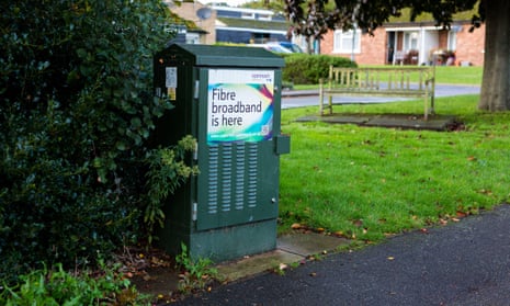 A green telecom cabinet advertising the release of fibre broadband.