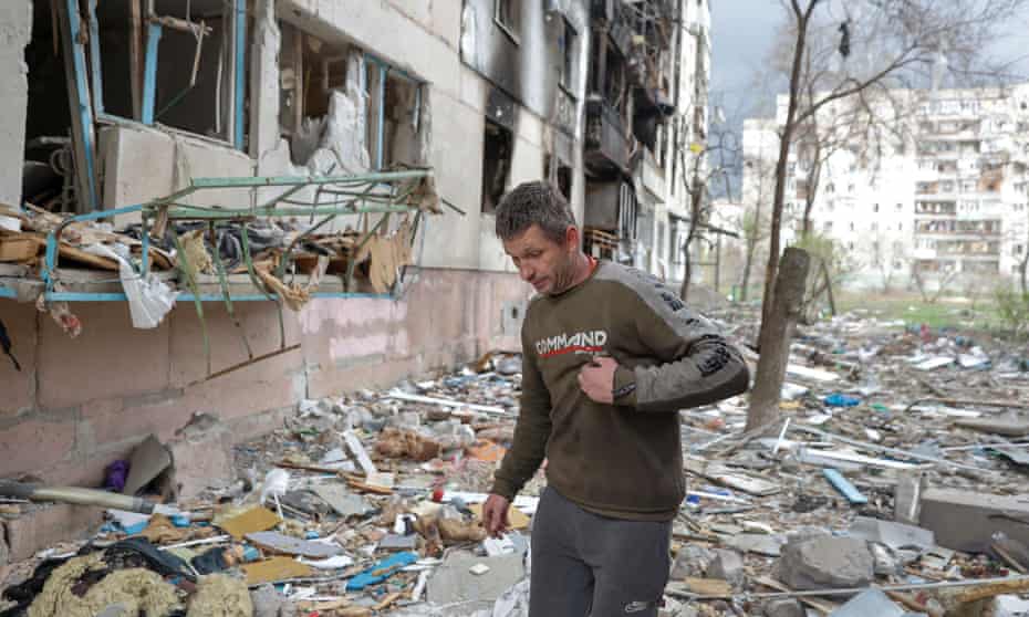 A man walks amid debris of a residential building in Sievierodonetsk, Ukraine.