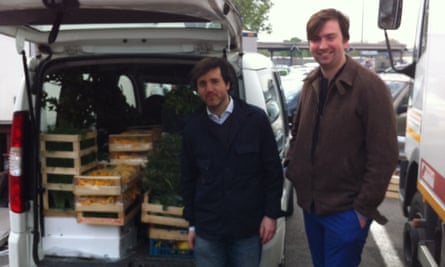 Franco Fubini beside a van filled with crates