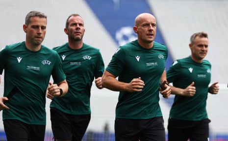 Szymon Marciniak and his team of match officials get their jog on at the Atatürk Olympic Stadium yesterday.