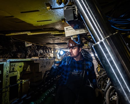 A student miner during a class in a laboratory tunnel