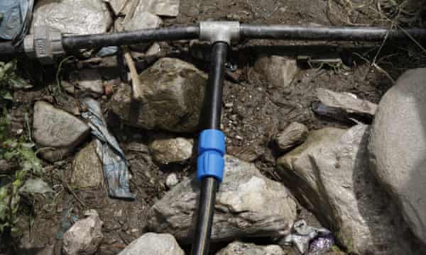 The blue fitting on a water pipe in Bahrabise IDP camp in Nepal.