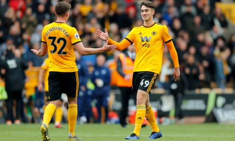 Max Kilman, right, is greeted by Leander Dendoncker as the former futsal international makes his Premier League debut for Wolves against Fulham in May.