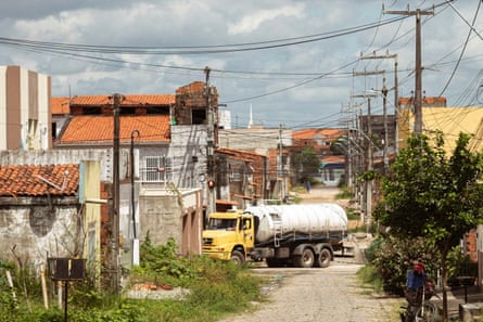 A water truck on a rural street