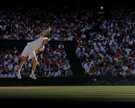 Jannik Sinner serves against Alexander Zverev in the 2026 men's singles final at Wimbledon