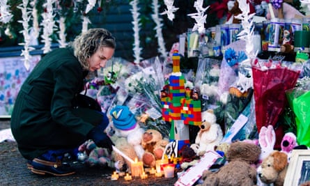 A woman visits a memorial to the victims of the Sandy Hook shooting.