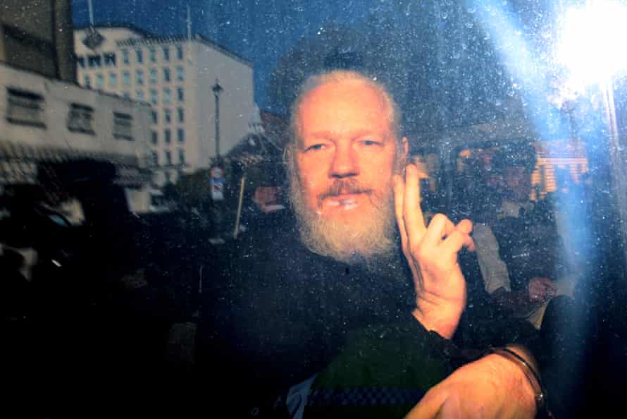 Held… Assange after his arrest in 2019.