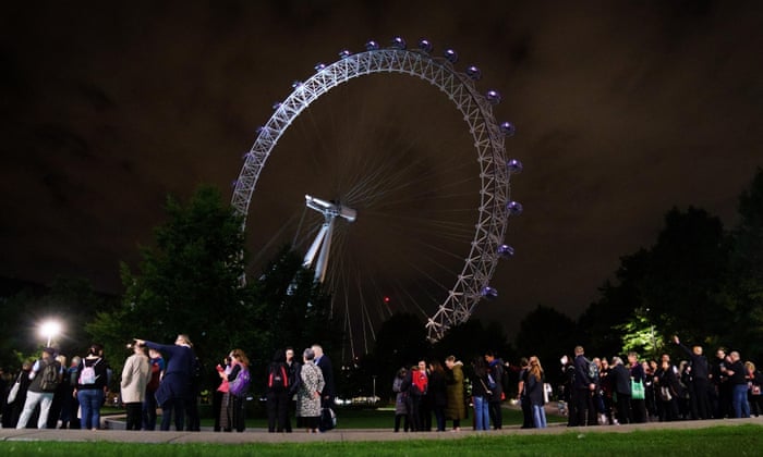 Death of Queen Elizabeth II Members of the public queue on London's South Bank next to the London Eye as they wait to see Queen Elizabeth II lie in state ahead of her funeral on Monday.