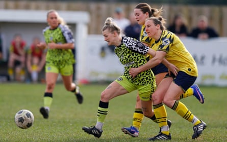 Hattie Jones, captain of Forest Green Rovers is tackled by Tee Kaptein of Torquay