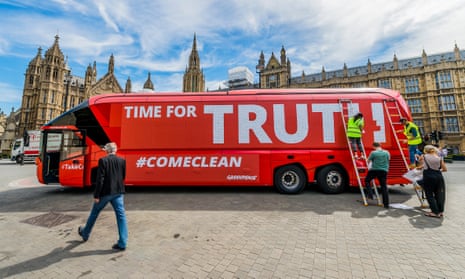 John Sauven, executive director of Greenpeace UK, strides past the Leave campaign’s battle bus that was re-branded and parked outside Parliament