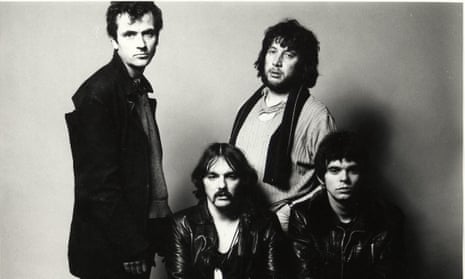 Defiant … the Stranglers, with Dave Greenfield seated middle.