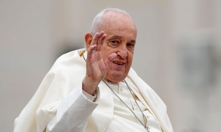 Pope Francis smiles and waves after celebrating Easter mass in St Peter's Square at the Vatican
