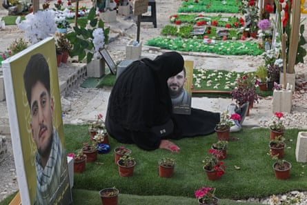 Ghada Hussein mourns astatine nan sedate of her boy Mohammed Tufayli astatine a makeshift cemetery successful Sidon, Lebanon