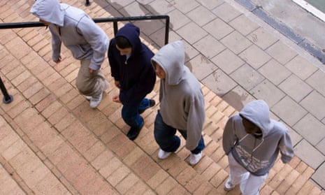 Four teenagers in hoodies