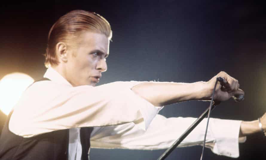 David Bowie performs on the Station to Station tour in 1976.