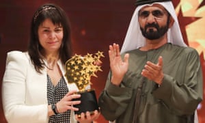Maggie MacDonnell receives the Global Teacher Prize from Sheikh Mohammed bin Rashid al-Maktoum.