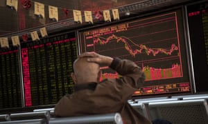 An electronic board shows the stock index and prices at a securities brokerage in Beijing.