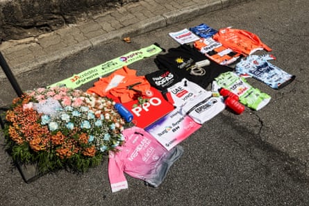 The peloton holds a minute of silence at a memorial for British cyclist Finlay Tarling before the ninth stage of Volta a Portugal.