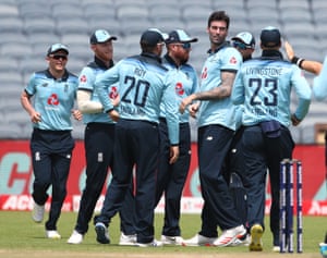 England bowler Reece Topley (second right) is congratulated by team mates after taking the wicket of India batsman Shikhar Dhawan.
