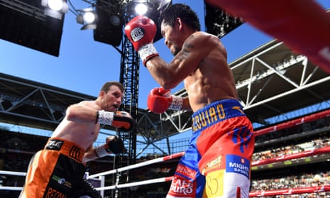 Jeff Horn trades blows with Manny Pacquiao intheir WBO World Welterweight title boxing match at Suncorp Stadium in Brisbane on Sunday.