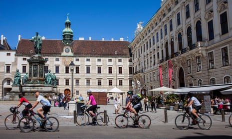Cyclists in front of the Hofburg palace, Vienna.