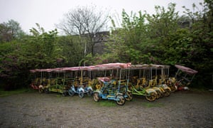 Vehicles for tourists are seen parked at an ancient city wall in Jingzhou after the lockdown was eased in Hubei.