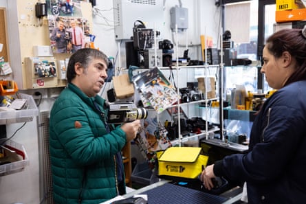 Vlahadamis explains a film movie camera to a customer