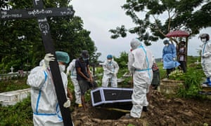 Volunteers wearing personal protective equipment (PPE) burying a suspected Covid-19 coronavirus victim at a cemetery in Taungoo district in Myanmar’s Bago region. A tightknit team of volunteers working tirelessly to treat, bury and cremate coronavirus victims are facing stigma from their families and being told not to return home due to fear of spreading the disease.