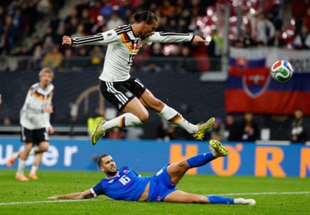 An airborne Leroy Sané (top) scores Germany’s fourth goal in the 6-0 win over Slovakia