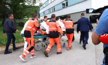 Slovak Prime Minister Robert Fico being transported by medics and his security detail to the hospital in Banska Bystrica.