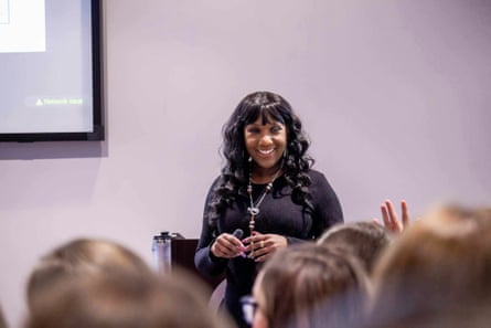 a woman speaks at a conference