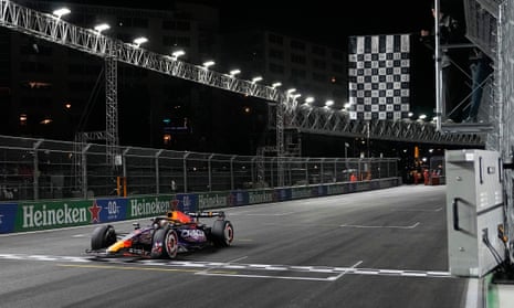 Max Verstappen passes the chequered flag, waved by none other than Justin Bieber.