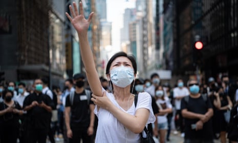 People protest against the ban on face masks in central Hong Kong.