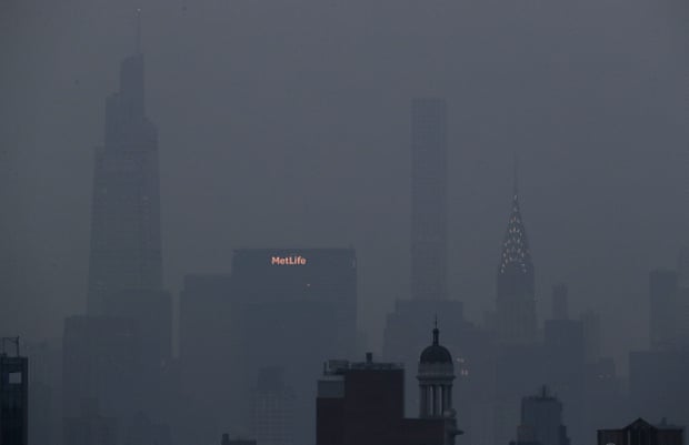 The Manhattan cityscape is choked by haze.
