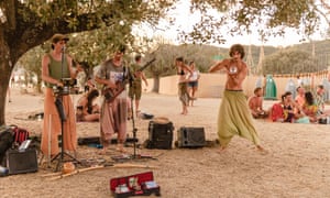 Musicians performing at BOOM Festival, an eco-friendly music festival in Portugal