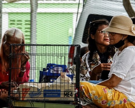 People rest at a shelter, following recent clashes along the disputed border between the two countries, according to authorities people have been killed across three border provinces, in Surin province, Thailand, July 24, 2025.